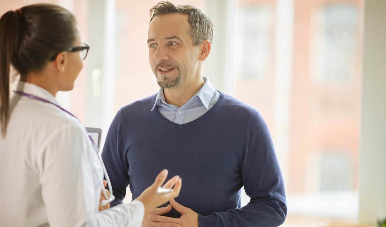 cinclus pharma man smiling while talking to female doctor