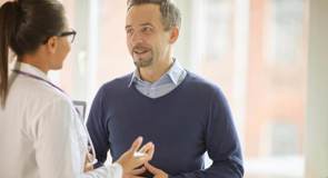 cinclus pharma man smiling while talking to female doctor