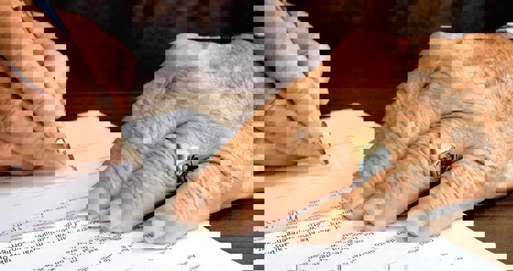 cinclus pharma close-up on elderly mans hands signing a contract