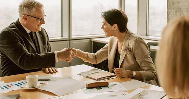 cinclus pharma man and woman shaking hands in board room