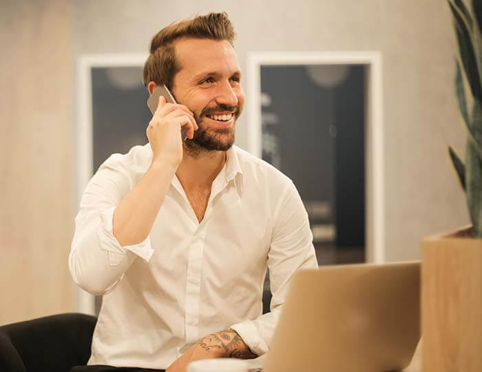 cinclus pharma man smiling while talking on the phone